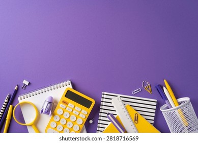 Back to school flatlay featuring a yellow calculator, notebook, ruler and pens on a vibrant purple background ideal for education and study visuals