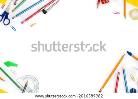 Back to School. Frame of school supplies ( pencil, scissors, sharpener, clips, crayons ) on a white background with space for text. Top view, flat lay