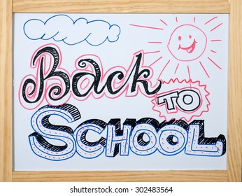 Back To School Hand Writing On Whiteboard Classroom Background