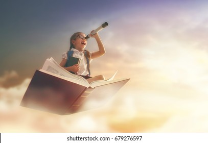 Back to school! Happy cute industrious child flying on the book on background of sunset sky. Concept of education and reading. The development of the imagination. - Shutterstock ID 679276597