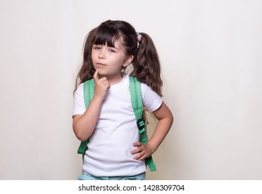 Back To School. Happy Pupil With Curly Hair And Blue Eyes With Schoolbag On White Background. Free Space For Your Text Or Advertisement. Child Holding Satchel. 