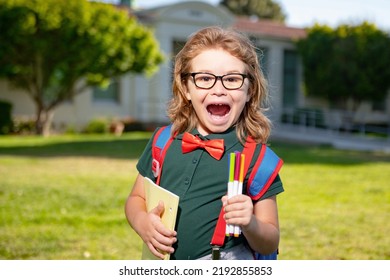 Back To School. Happy Smiling Excited Pupil From Primary School. First Day Of Autumn Fall.