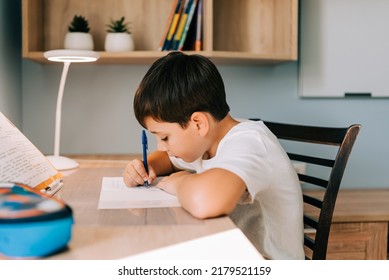 Back to School home online learning, distance lesson, education at home, technology for school. Children doing homework at exercise book writing at home - Powered by Shutterstock