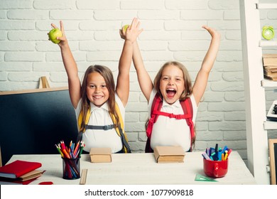 Back To School And Home Schooling. Happy School Kids At Lesson In September 1. Friendship Of Small Sisters In Classroom At Knowledge Day. Little Girls Eat Apple At Lunch Break. School Time Of Girls.