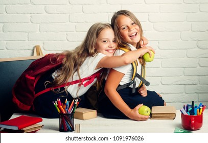 Back To School And Home Schooling. Little Girls Back To School At Knowledge Day