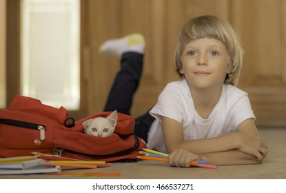 Back To School. Kid Getting Ready For School Packing Backpack With Stationary And White Cat