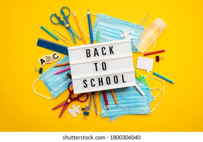 Back To School Lightbox Message With School Equipment And Covid Masks