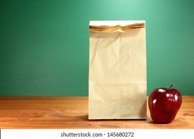 Back To School Lunch Sack Sitting On Teacher Desk