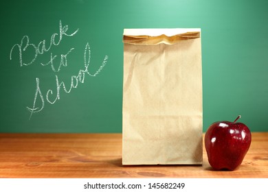 Back To School Lunch Sack Sitting On Teacher Desk