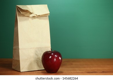 Back To School Lunch Sack Sitting On Teacher Desk