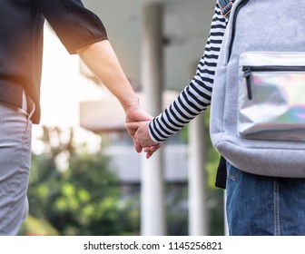 Back To School, Parent's Day, Bring Kid To Work, Educational Concept With Elementary Student Girl Carrying Backpack Holding Woman Or Mother's Hand Walking Up Admission Office Building Going To Class