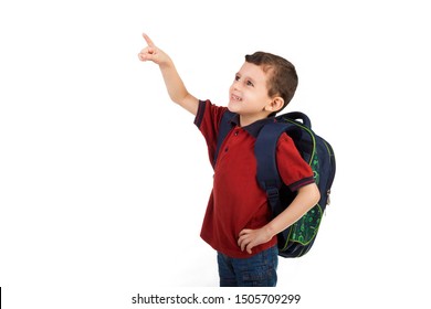 Back to school - Portrait of Arabian school boy child smiling and pointing with his finger - isolated on white background