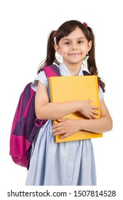 Back to school - Portrait of Arabian school girl child holding a book smiling with school bag , isolated on white background