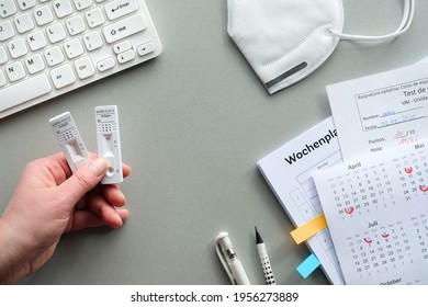 Back To School, School Reopening With Quick Coronavirus Tests. Self Testing Strategy Concept.. Hand With Antigen Covid Tests, Calendar With Marked Dates, Pp2 Mask, School Schedule, Computer Keyboard.