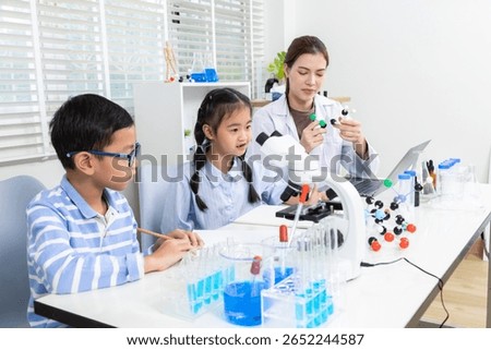 Back to school with science experiment teaching by teacher in academic classroom school, using microscope and test tubes to develop student knowledge, preparation, innovation, and joyful exploration