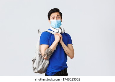 Back To School, Studying On Covid-19, Education And University Life Concept. Nervous Young Asian Guy In Medical Mask, Student Freshman Feel Worried First Day College, Wear Medical Mask And Backpack