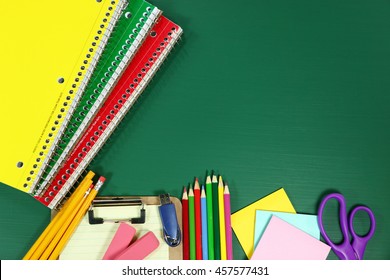 Back to School Supplies on Blank Chalkboard