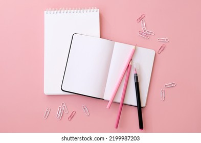 Back To School Supplies Stationery On Pink Background, Flat Lay, Top View. Education Accessories And Open Paper Notebooks, Pencils, Other Stuff. Stationary Promotion Flatlay From Above.