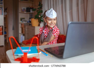 Back To School, Supply List. Cute Schoolgirl With Tablet Showing To Online Friend Her New School Equipment And Discussing New School Dress Code, Face Mask. Social Distance Learning And New Guidance