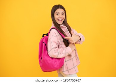 Back To School. Surprised Teen Girl In Checkered Shirt. Happy Kid Casual Style Carry Backpack. Tween Child With School Bag. Childhood And Education. Autumn Fashion Style. Cheerful Student.