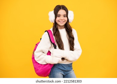 Back To School. Teenager Schoolgirl With Warm Hat And Sweater On Yellow Isolated Studio Background. Winter School.