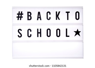 Back to school text in a light box. Box isolated over white background. A sign with a message
