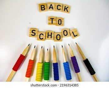 Back To School Text On Wood Letter Blocks With Rainbow Colorful Pencils, School Year Starting For Studies