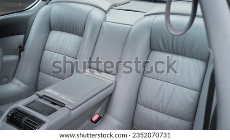 Back seat of a car in grey leather