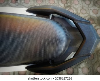 The Back Seat Of A Motorcycle Is Equipped With A Handle For The Pillion As Well As For Variety