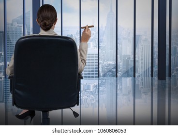 Back of seated business woman smoking cigar and looking at blue window - Powered by Shutterstock