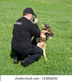 Back Of A Security Guard With A Dog