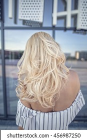 Back Shot Of Woman With Blonde Hair