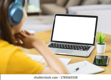 Back Side Of Asian Business Woman Using Laptop With White Screen For Creative And Design In Modern Of House, Working From Home And Stay At Home When Covid-19 Outbreak,blank Screen Mockup Copy Space