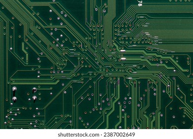 back side of green digital circuit board - flat full-frame background and texture.