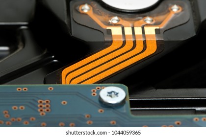Back side of hard disk drive with orange tire