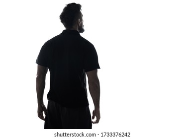 Back side silhouette of male person , back view back lit over white 