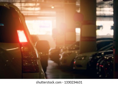 Back side of traffic jam under the building. Open red color of light break. 