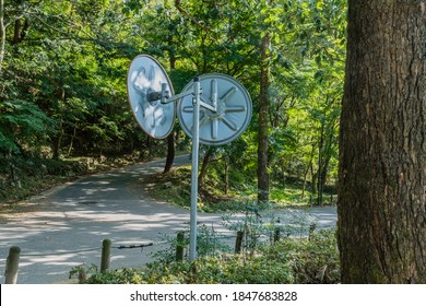 Back Side Of Traffic Mirrors At Rural Three Way Intersection.