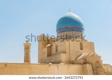 Back side view of the Kalan Mosque at Po-i-Kalan complex in Bukhara, Uzbekistan. The ensemble is a popular tourist attraction of Central Asia.