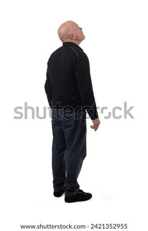 back side view of a man looking up on white background