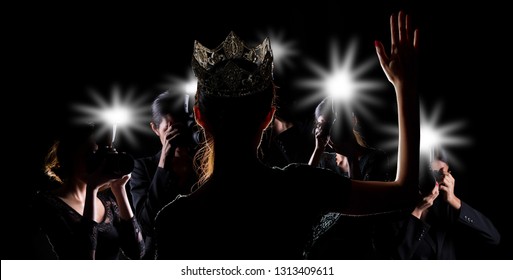 Back side view of Miss Pageant beauty contest with Silver Diamond Crown wave hand to many Photographers who shoot photo image to celebrity at red carpet event, and flash fire light came out copy space