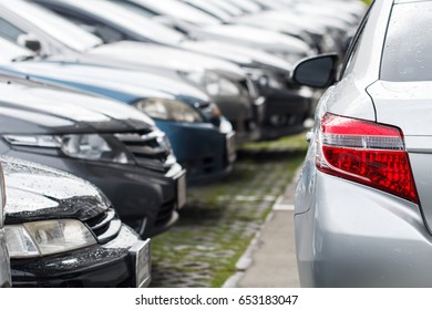 Back Of Silver Car Parking Outdoor After Rain