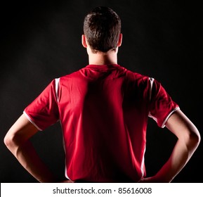 back of soccer player on black background - Powered by Shutterstock