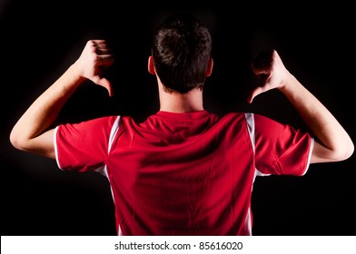 back of soccer player on black background - Powered by Shutterstock