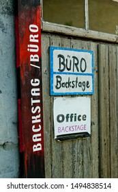 Back Stage Sign On An Old Weathered Door Entrance