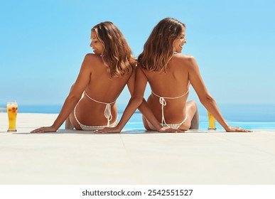 Back, swimming pool and women with cocktails, relax and travel with happiness, vacation and smile. Outdoor, bikini or people with alcohol, getaway trip and twin sisters with adventure and blue sky