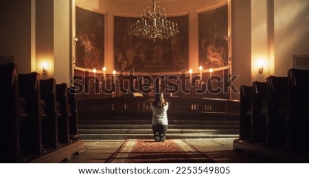 Back Symmetrical View: Christian Woman Getting on her Knees and Starting to Pray in a Church. Devoted Parishioner Seeks Guidance From Faith and Spirituality. Religious Believer in Power of God