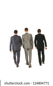 Back Of Three Business Men Walking Isolated On White Background