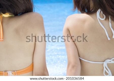 Back two female of swimsuit
