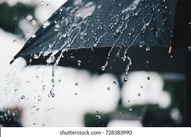 Back Umbrella in the rain in vintage tone - Shutterstock ID 728383990